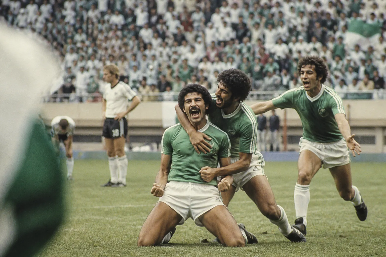Fictional Algerian footballers celebrating their famous 1982 World Cup victory over West Germany