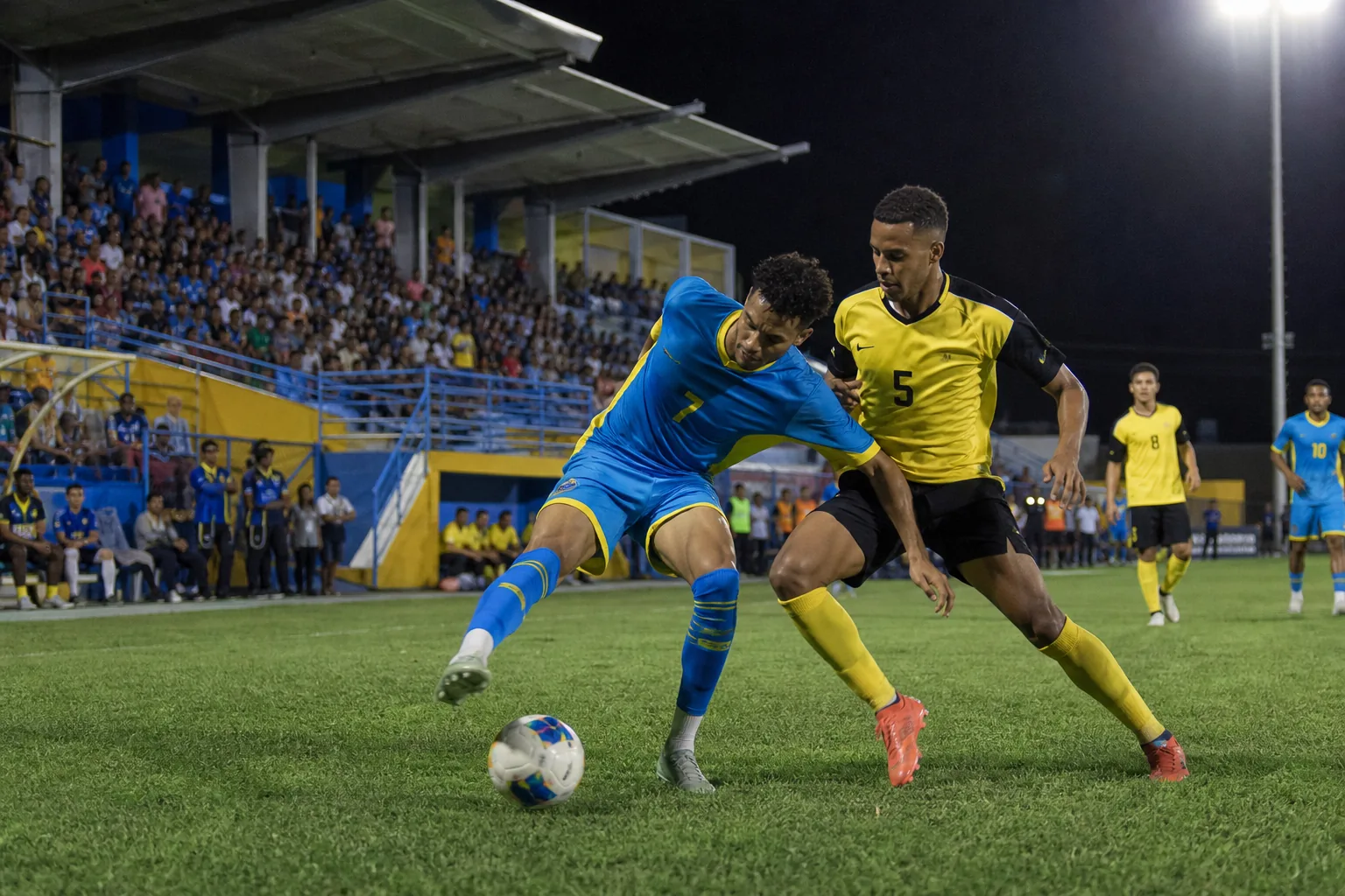 Aruba national-team players training together on a compact island football ground