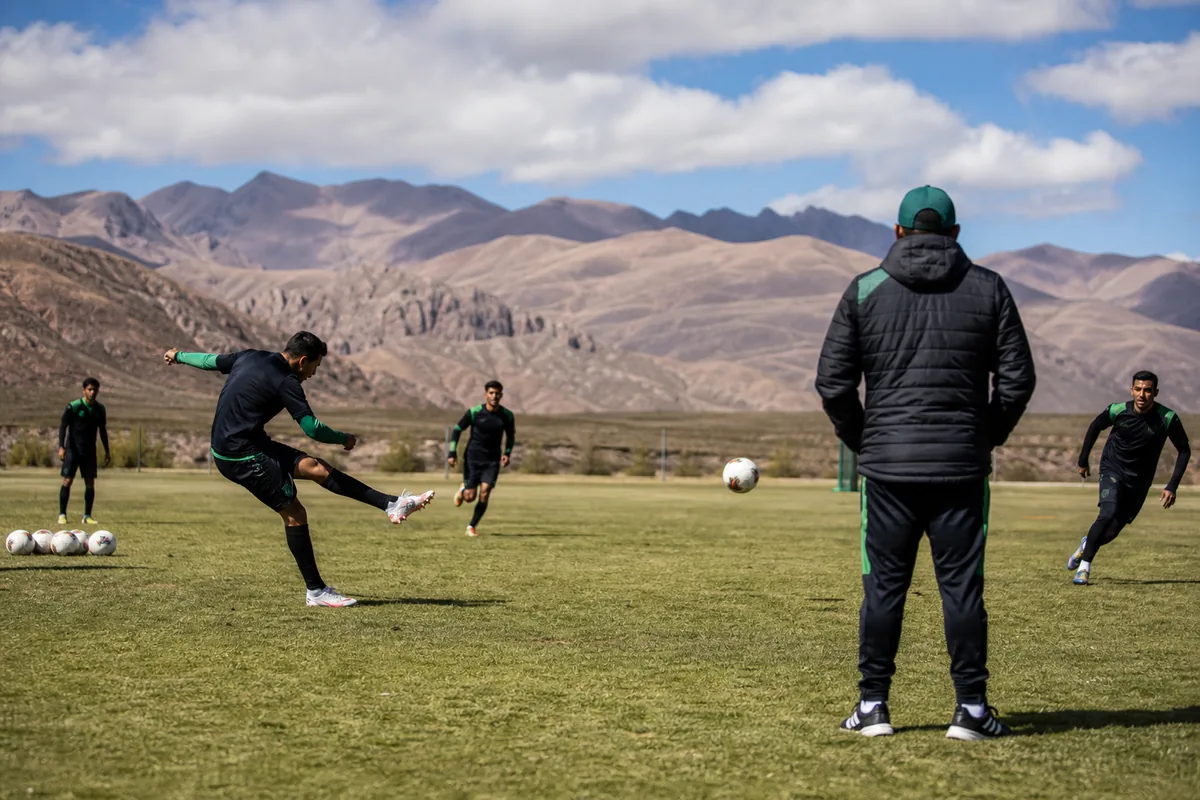 Fictional Bolivia players adapting to high-altitude football in a tactical training session while a coach observes