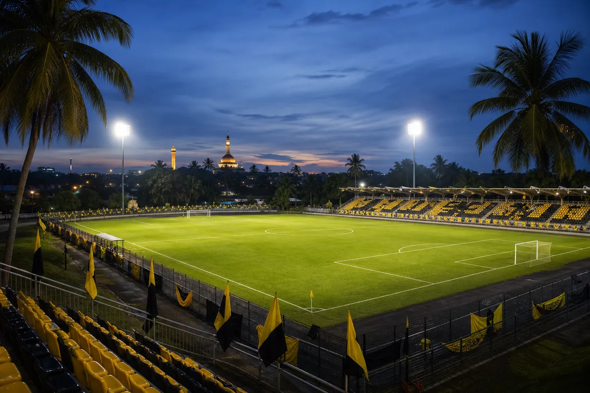 A compact Brunei football stadium-inspired ground prepared for an AFF Championship match among tropical palms