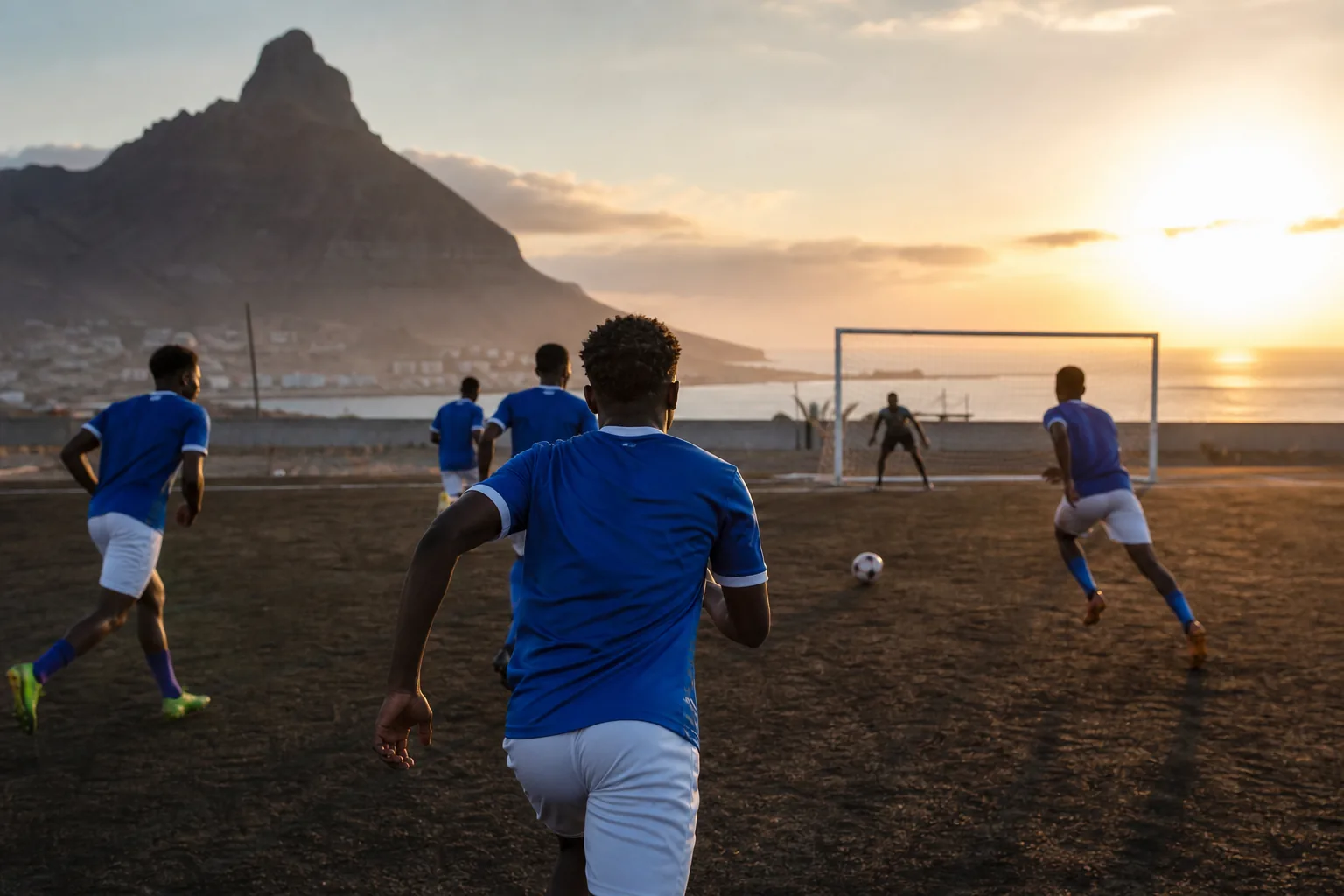 Cape Verde national-team players training together on a coastal football ground
