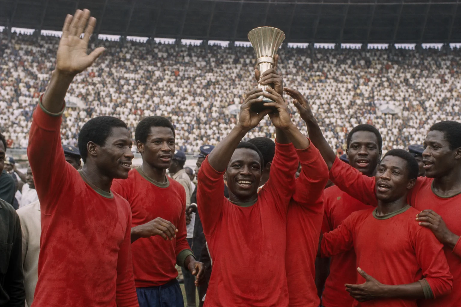 Republic of Congo Red Devils celebrating their 1972 Africa Cup of Nations victory with a continental trophy