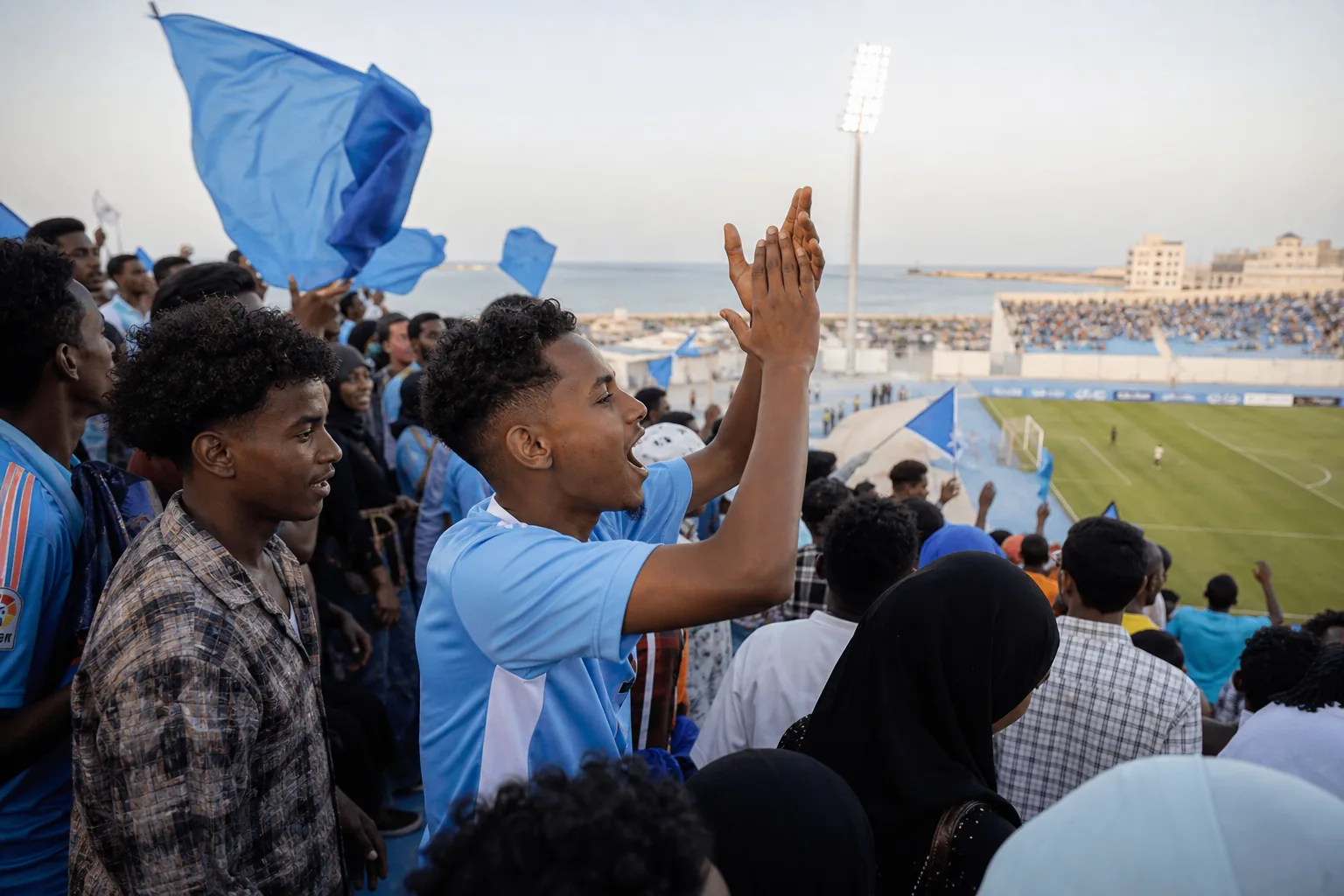 Djibouti players competing in a tense African qualifying match under stadium lights
