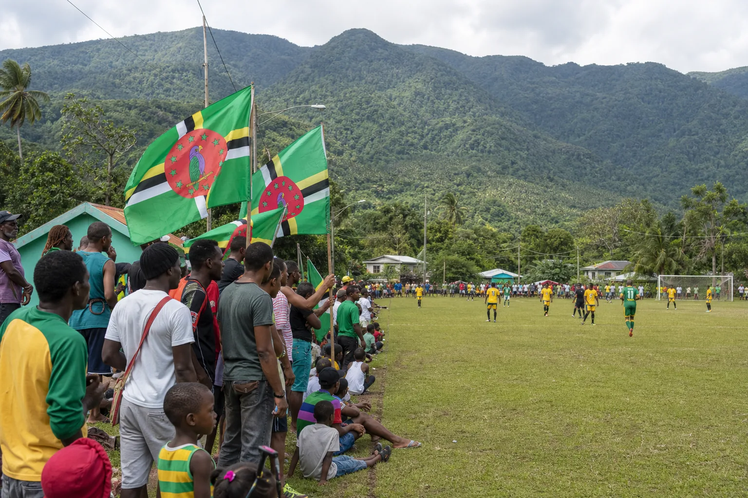 Dominica players competing in an intense CONCACAF Nations League match under stadium lights