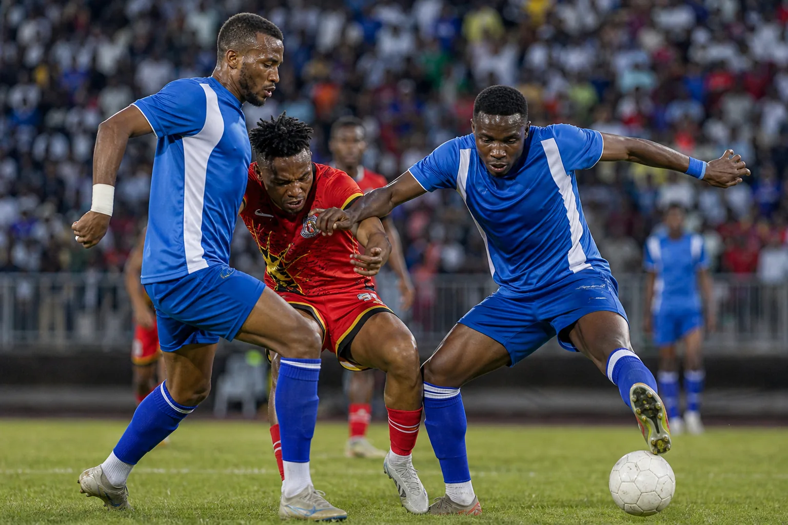 Eswatini players competing in an intense COSAFA Cup match against a southern African rival