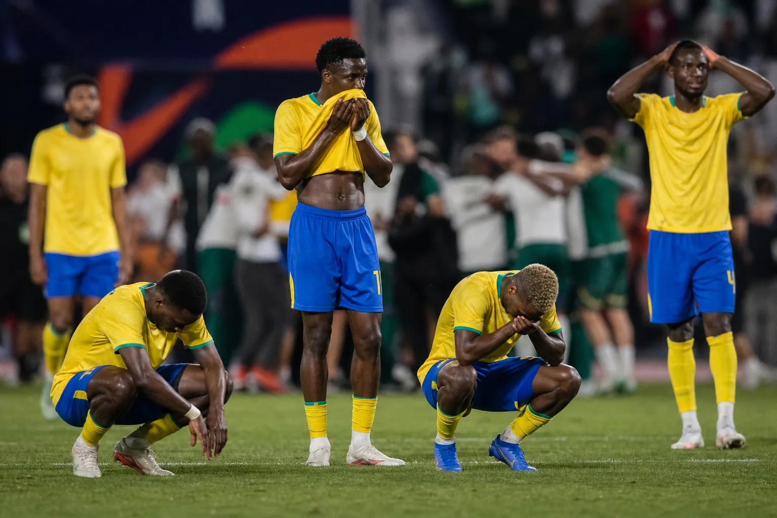 Gabon players reacting after a tense AFCON quarter-final penalty shootout defeat
