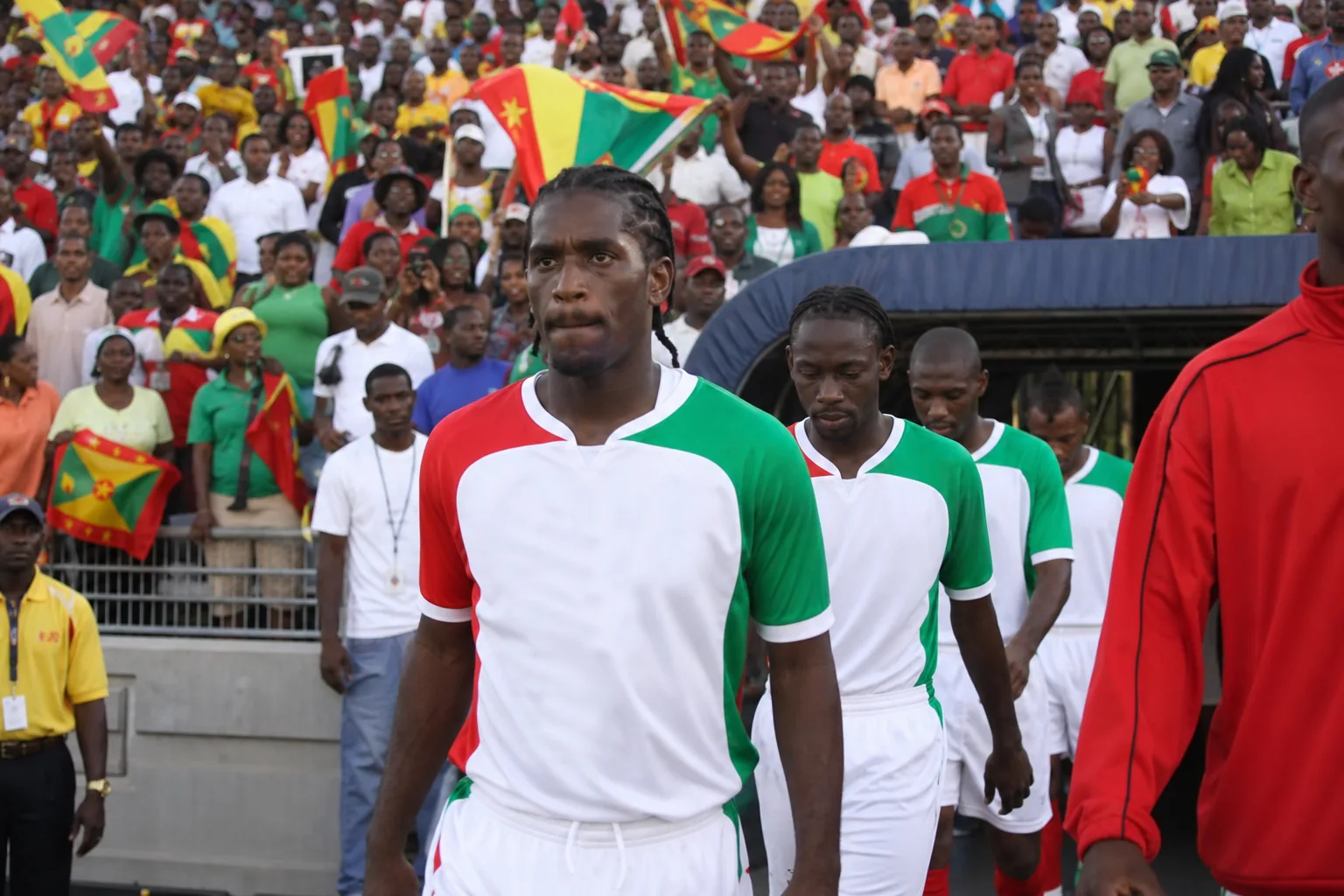 Grenada Spice Boys preparing together in red-white-green kits before a major Caribbean match