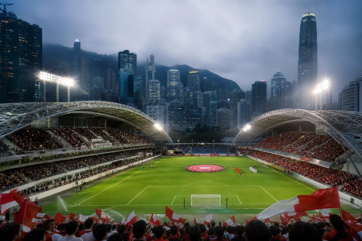 A Hong Kong Stadium-inspired football ground with the city skyline and hills behind the stands