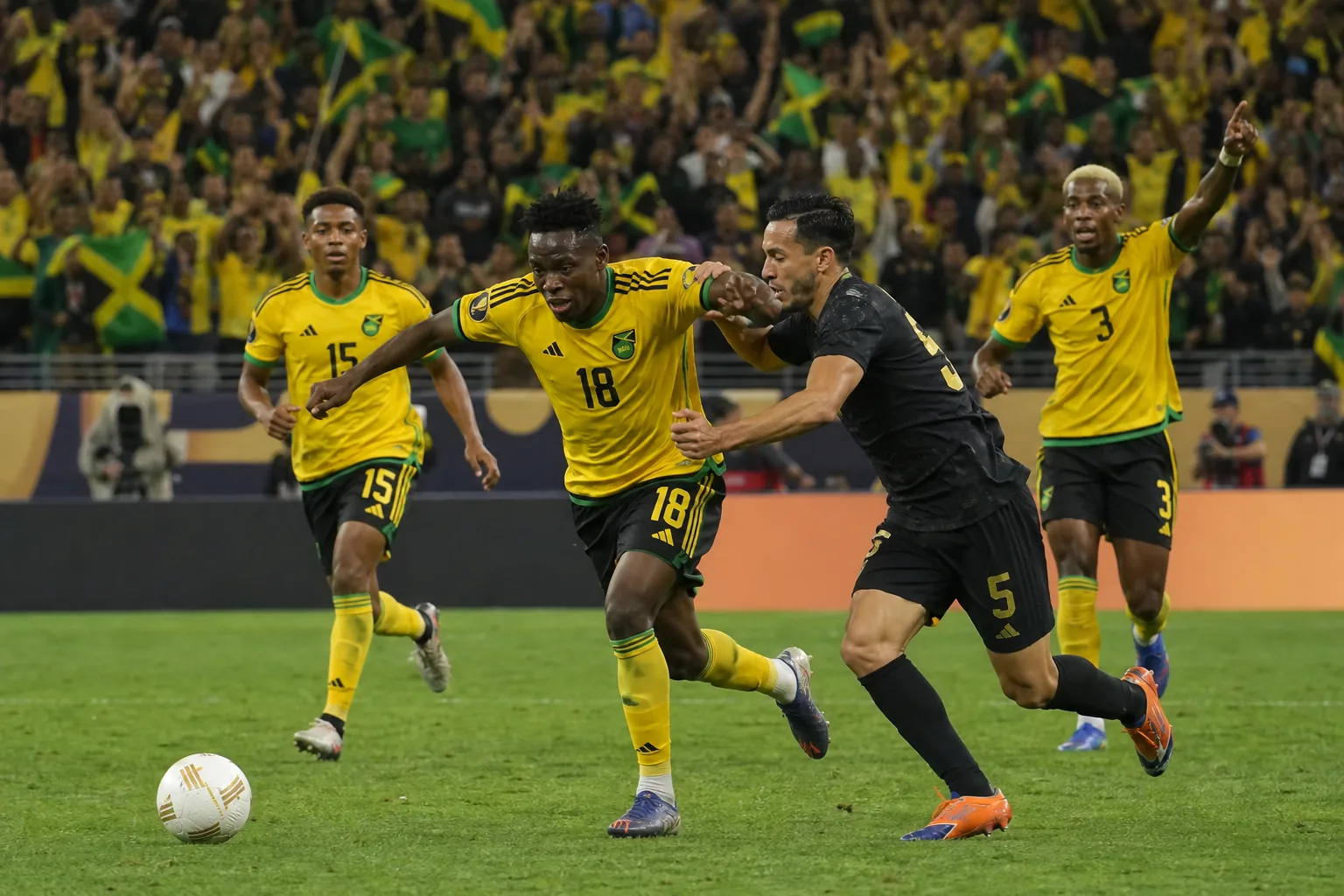 Jamaica Reggae Boyz preparing for a CONCACAF match in black-and-gold kits