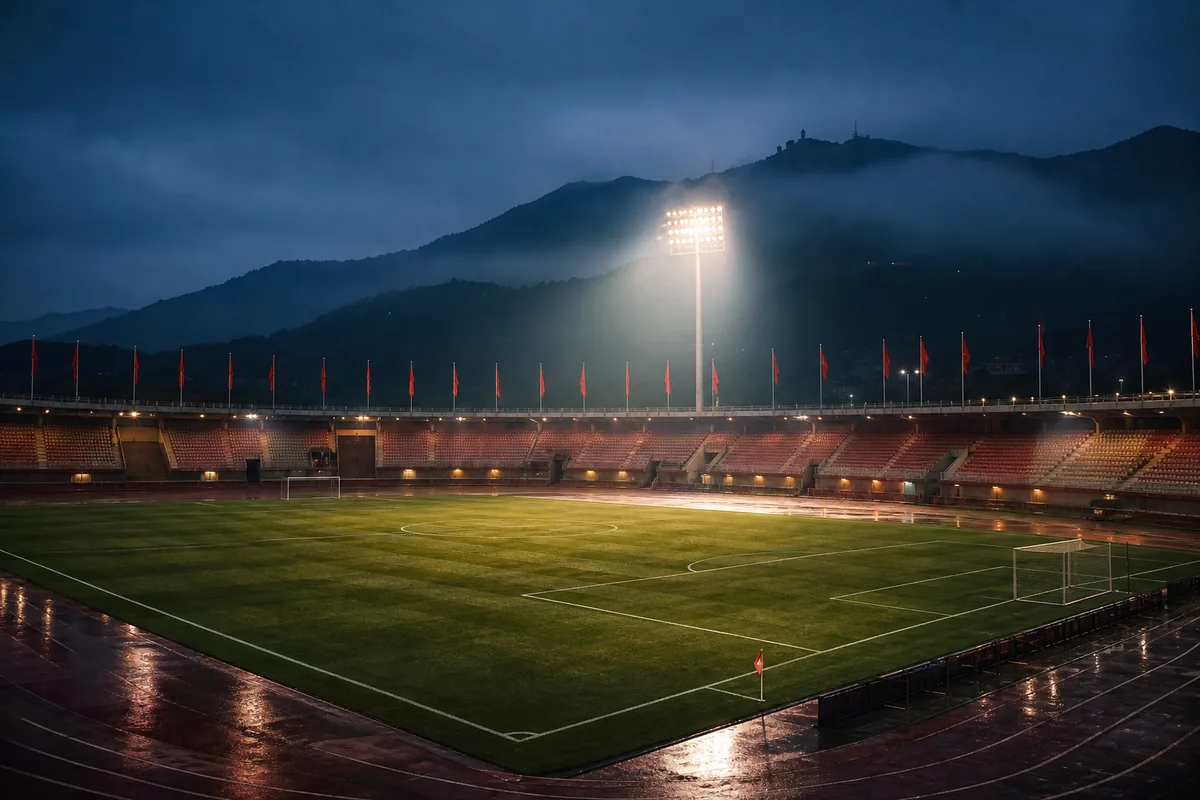 A classic Asian football stadium-inspired ground prepared for an international match under dramatic floodlights