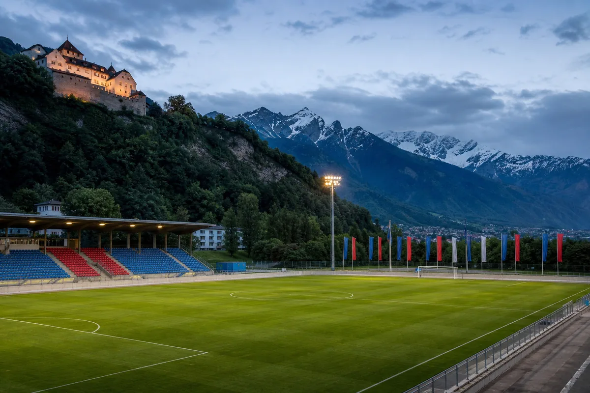 Rheinpark Stadium in Vaduz beneath the Alps and Vaduz Castle at dusk