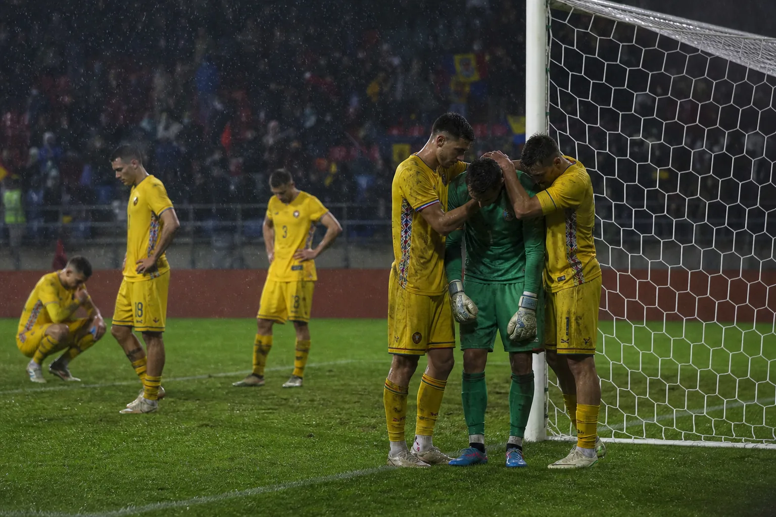 Fictional Moldovan players reacting after a narrow qualifying defeat