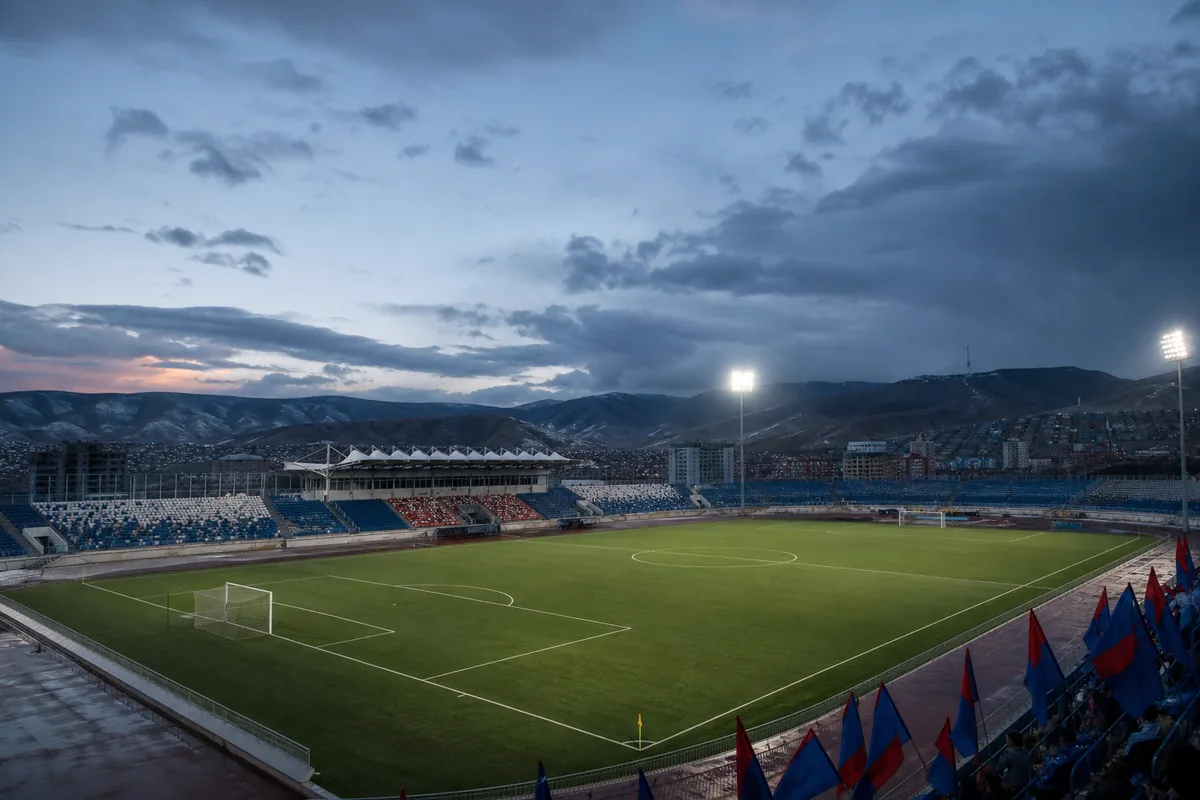 A Ulaanbaatar stadium-inspired football ground prepared for an AFC qualifying match beneath open skies