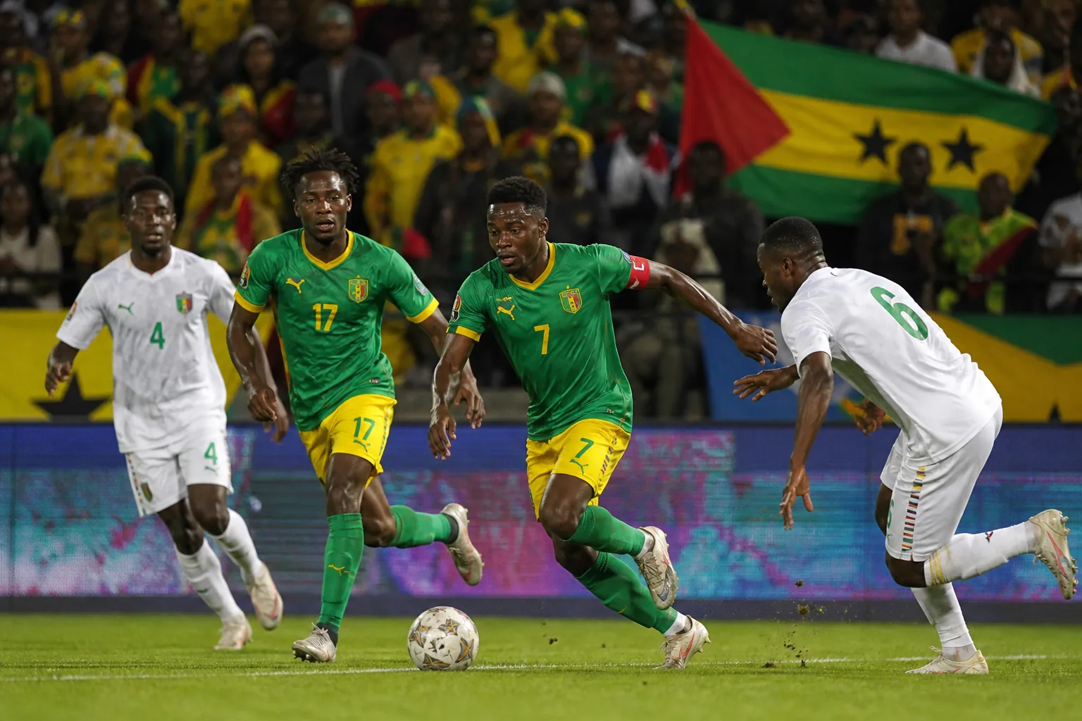 Sao Tome and Principe footballers competing in an intense African qualifying match