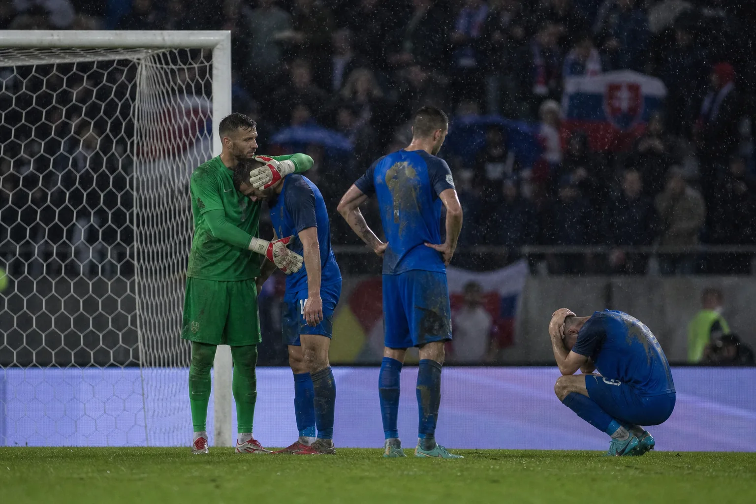 Fictional Slovak players reacting after a narrow knockout defeat