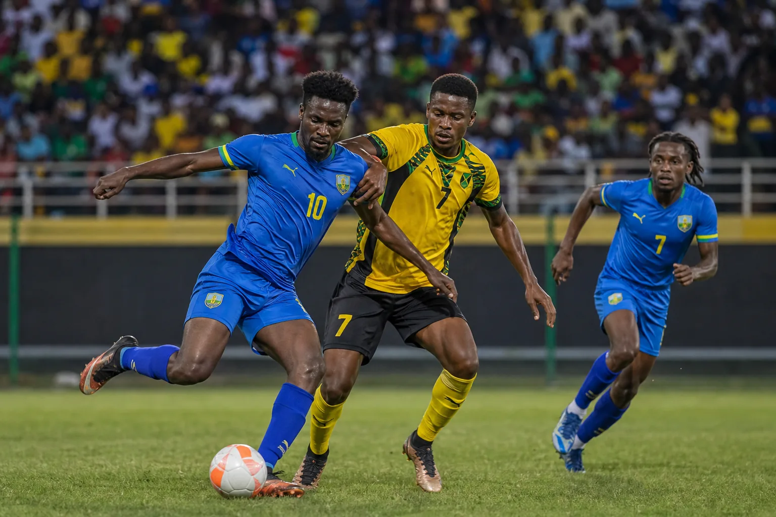 Saint Vincent and the Grenadines footballers competing in an intense Caribbean match