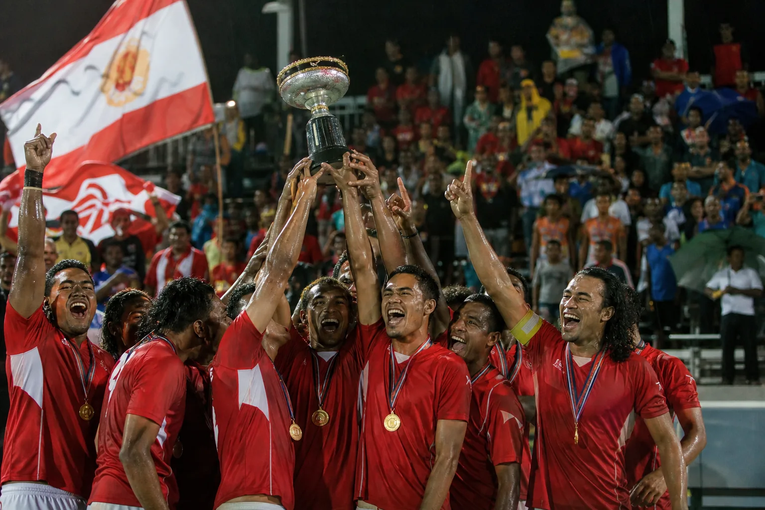Tahiti celebrating the historic 2012 OFC Nations Cup final victory before Pacific supporters