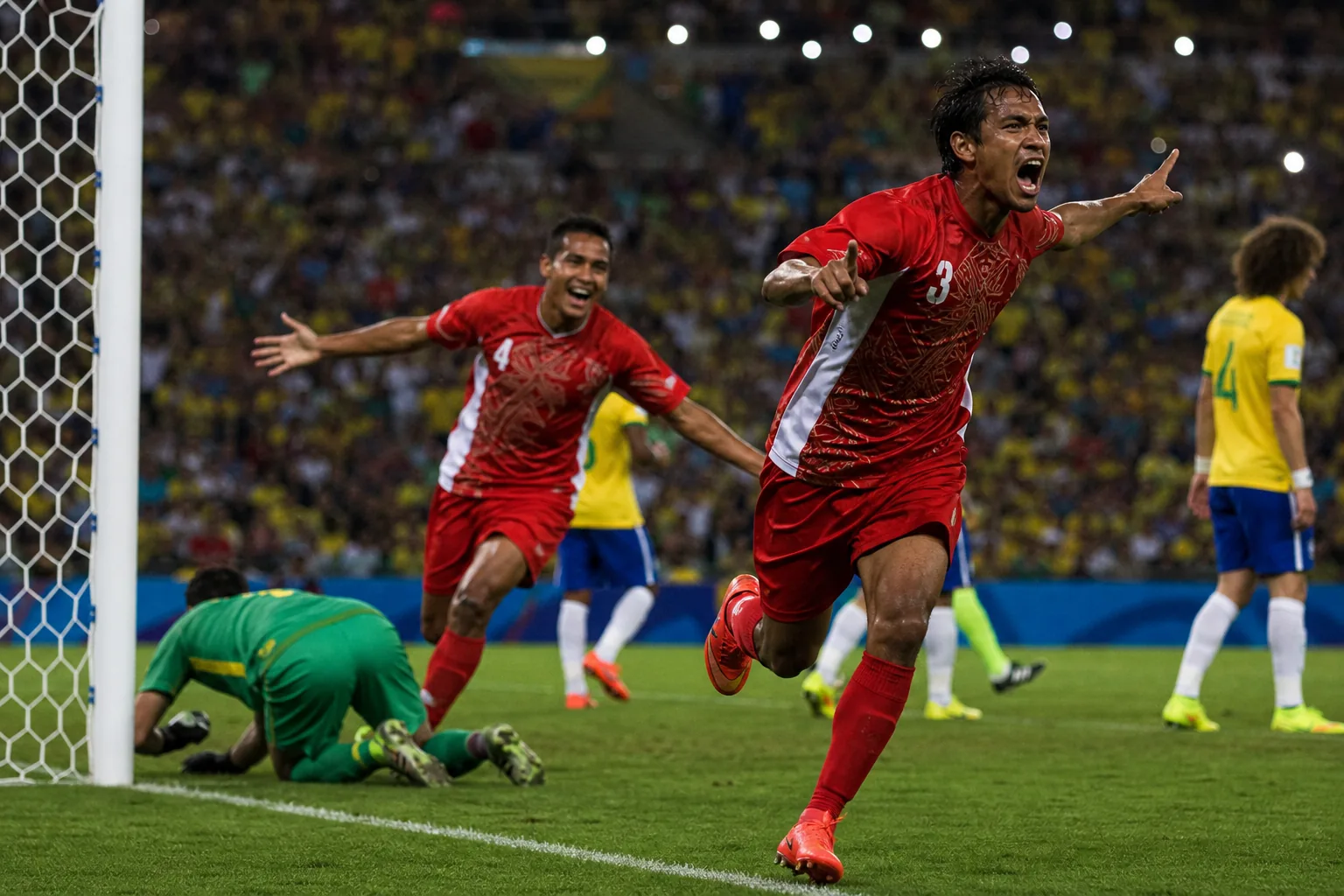 Tahiti footballers scoring and celebrating on the 2013 global stage in Brazil