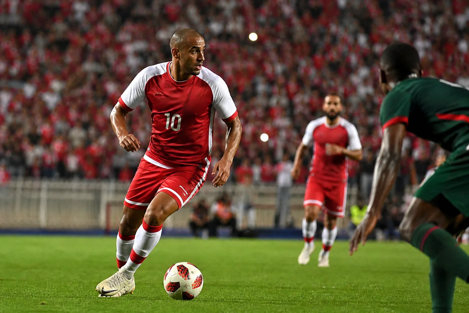 A fictional Tunisian national-team star attacking midfielder inspired by Wahbi Khazri leading an attack in a packed Tunis stadium