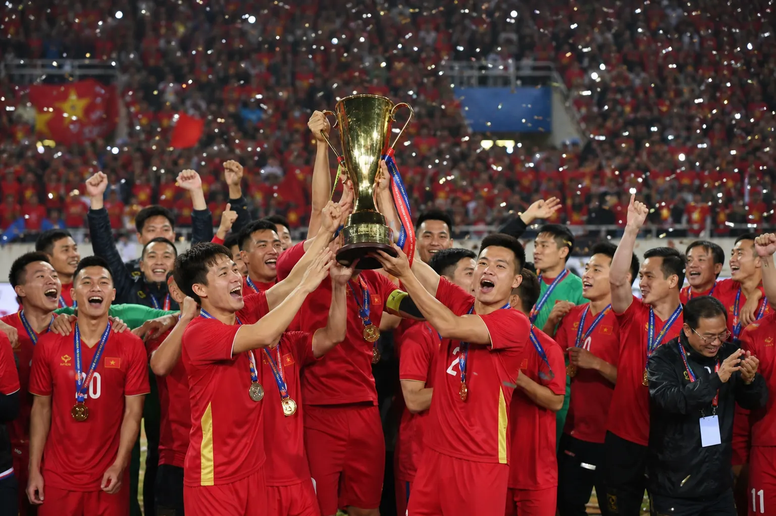 Fictional Vietnamese footballers lifting the AFF Championship trophy after the 2018 final