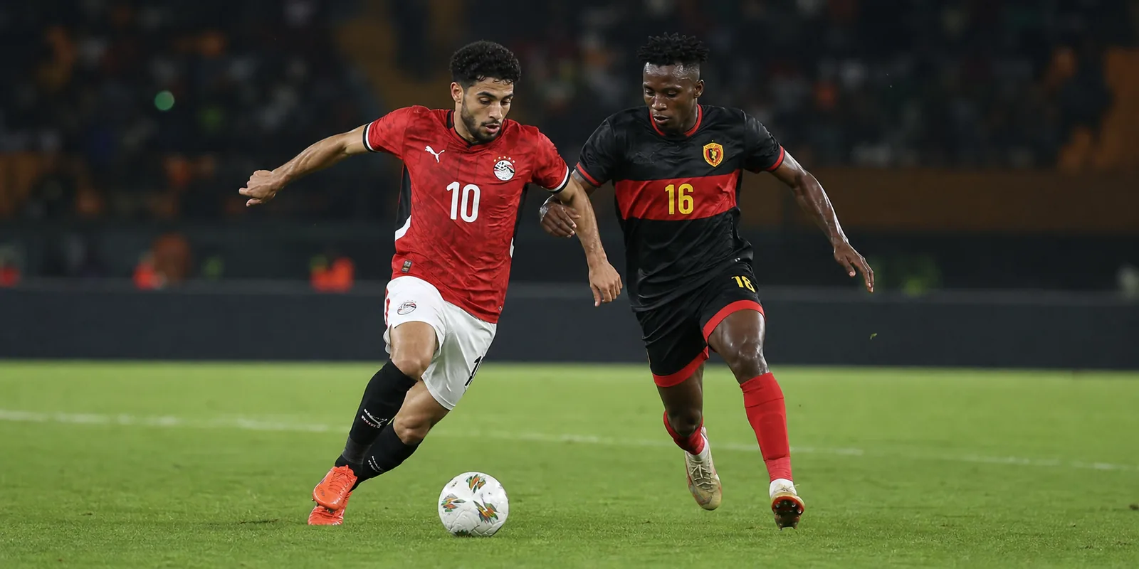 Conceptual illustration of an Egypt attacker competing with an Angola-inspired opponent